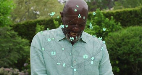 Senior man engaging with virtual health interface in garden