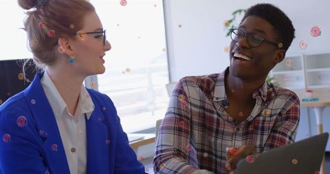 Diverse colleagues interacting with digital overlay elements