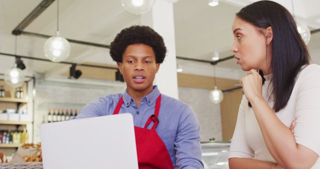 Barista Explains Menu to Customer in Modern Coffee Shop - Download Free Stock Images Pikwizard.com