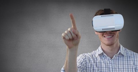 Man Using Virtual Reality Headset Against Grey Background - Download Free Stock Images Pikwizard.com