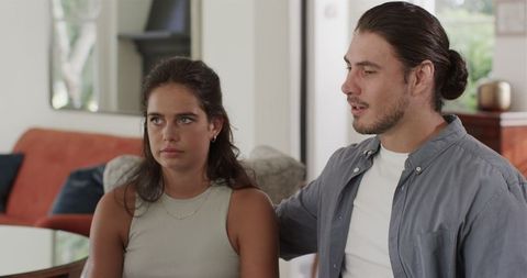 Couple discussing wedding plans at home