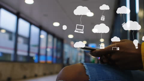Person Using Mobile Phone with Cloud Computing Icons on Subway