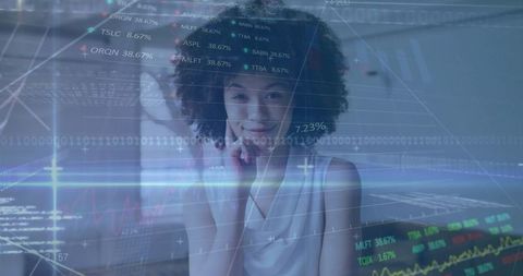 Smiling professional with financial graph analysis overlay