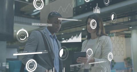 Colleagues reviewing tablet with ar data visuals for business analytics collaboration