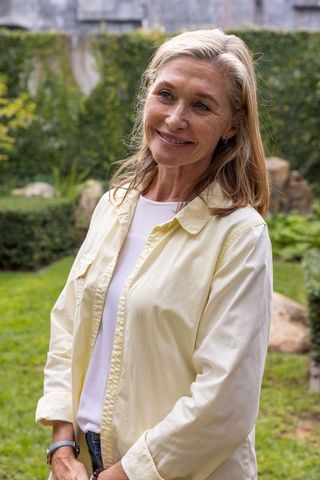Senior Woman Relaxing Outdoors in Casual Attire