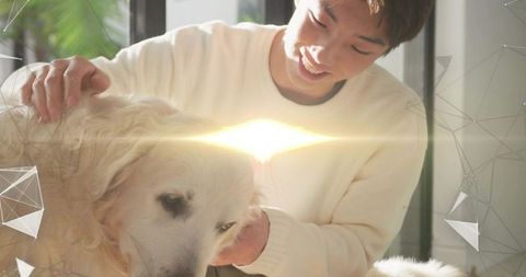 Sunlit korean teen petting golden retriever by window wearing cream sweater, cozy bond