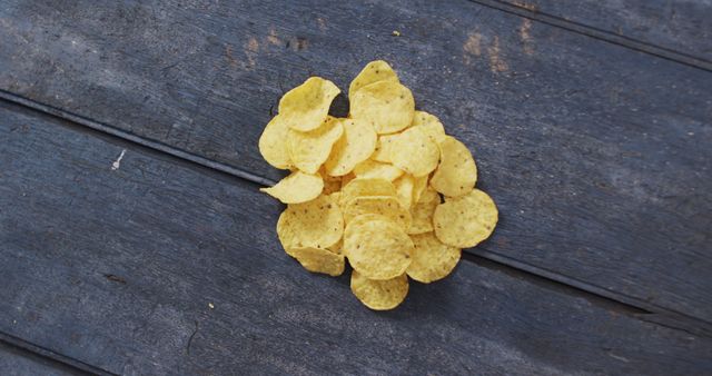 Close up view of potato chips falling with copy space on wooden surface - Download Free Stock Photos Pikwizard.com