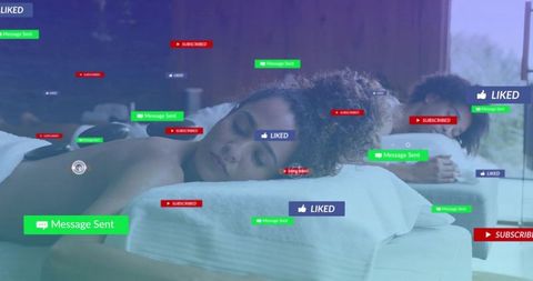 Couple relaxing on spa massage tables surrounded by social media notifications concept