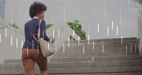Professional woman climbing stairs with coffee in modern plaza