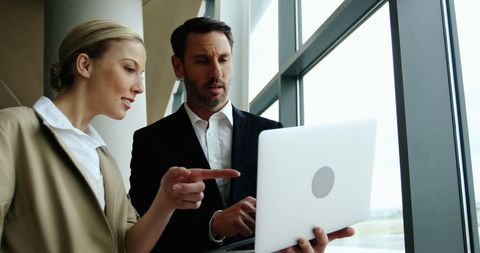 Business Professionals Collaborating with Laptop at Airport - Download Free Stock Images Pikwizard.com