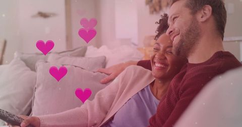 Diverse Couple Relaxing Together and Enjoying TV at Home