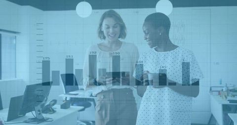 Colleagues Reviewing Data on Tablet in Modern Office