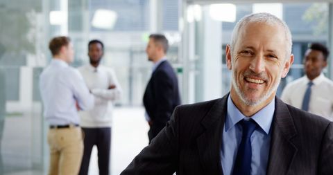 Confident Older Businessman in Modern Office Environment
