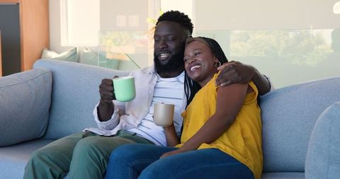 African American Couple Sharing Relaxing Coffee Moment at Home