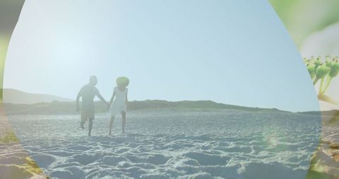 Joyful African American Couple Running on Sandy Beach