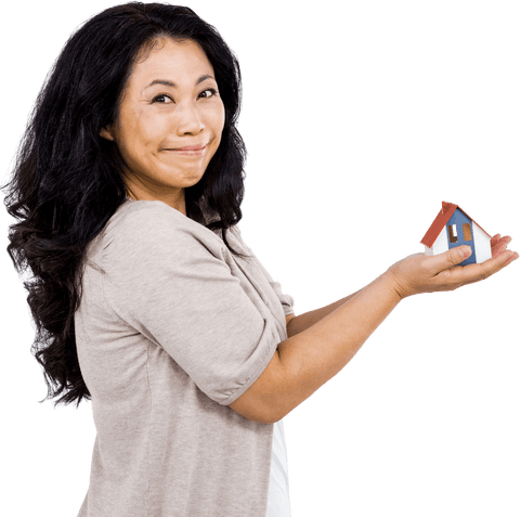 smiling woman holding small transparent house model - Download Free Stock Videos Pikwizard.com