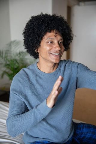 Man in casual attire enjoying relaxing moment at home