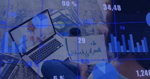 Remote professional analyzing financial dashboards and kpi charts on laptop and tablet