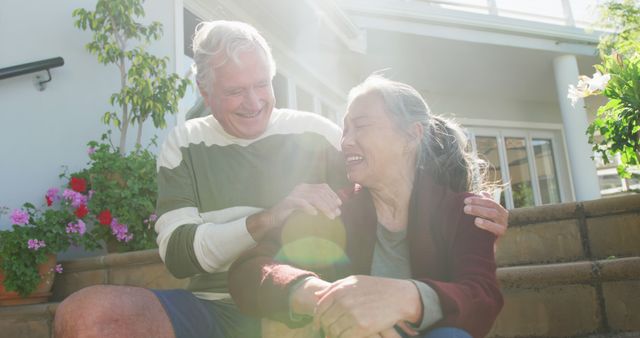 Happy Senior Couple Enjoying Outdoor Time in Sunlit Garden - Download Free Stock Images Pikwizard.com