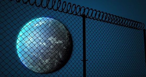 The Globe Viewed Through Barbed Fence in Digital Universe