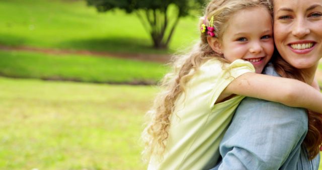 Mother and Daughter Smiling and Hugging Outdoors in Park - Download Free Stock Images Pikwizard.com