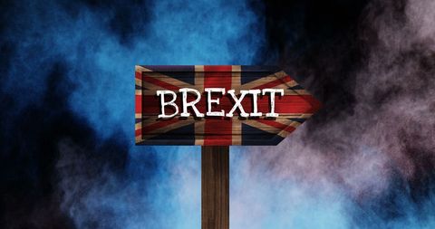 Brexit Concept Sign on United Kingdom Flag with Colorful Smoke