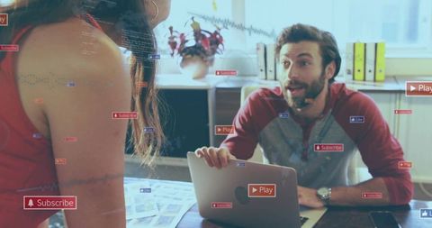 Team collaborating in modern office with interactive media