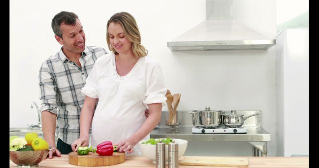 Happy Expectant Couple Preparing Healthy Meal Together in Kitchen - Download Free Stock Images Pikwizard.com