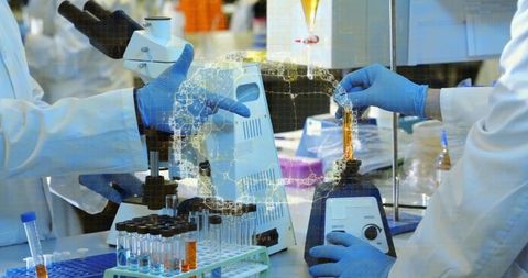 Scientist preparing experiment with laboratory instruments in research facility