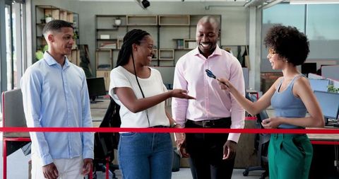 Business team in office, cutting ribbon opening new workspace