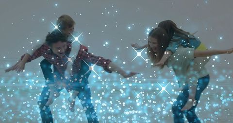 Family Playing Piggyback on Windy Beach with Sparkling Blue Bokeh and Motion Blur