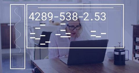 Senior woman analyzing financial data on laptop