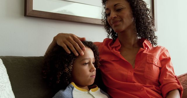 Loving Mother Comforting Sad Child on Sofa at Home - Download Free Stock Images Pikwizard.com