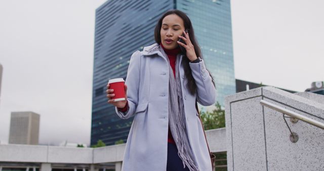 Professional Woman Talking on Phone Outdoors Holding Coffee - Download Free Stock Images Pikwizard.com