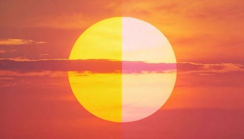 Duotone split sun at sunrise minimalist symmetric orb in vibrant orange-pink sky
