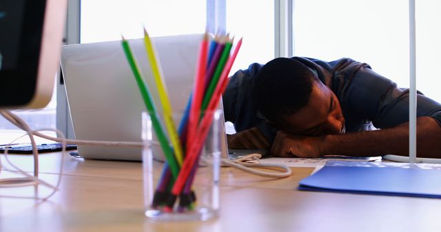 Exhausted Young Professional Sleeping at Desk - Download Free Stock Images Pikwizard.com