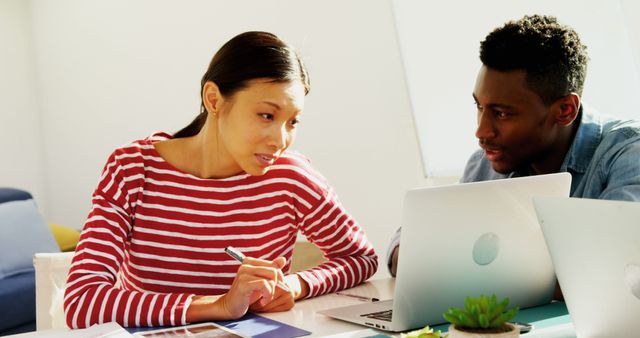 Multiracial colleagues collaborating on project in modern office - Download Free Stock Images Pikwizard.com