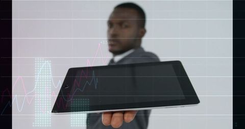 Presenting tablet with interactive financial charts and analytics dashboard for business