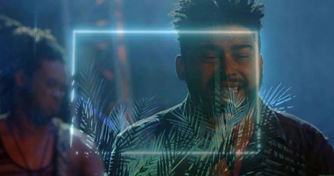 Singing vocalist performing with neon frame and tropical palm projection on moody stage