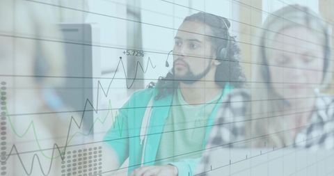 Focused Call Center Agents Analyzing Data in Modern Office