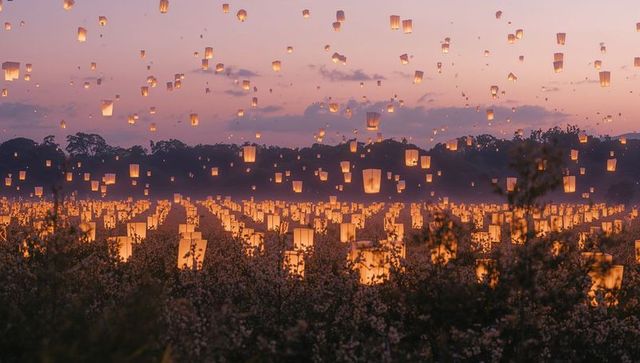 Illuminated Sky Lanterns Creating Stunning Twilight Display