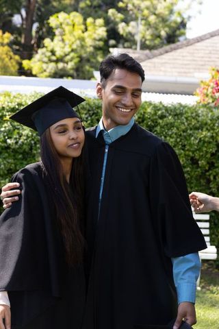 Joyful Indian Graduates Celebrating Friendship in Garden