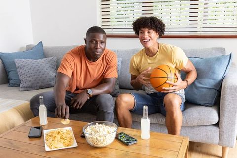 Diverse Friends Enjoying Leisure Time with Snacks and Basketball