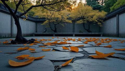 Autumn Leaves on Stone Path in Serene Courtyard