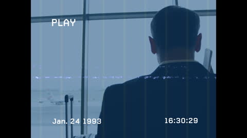 Retro Style Businessman Using Cellphone by Airport Window