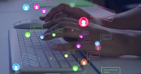 Hands typing on laptop with digital communication overlay