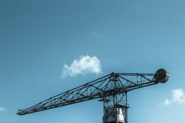 Large Industrial Crane Against Blue Sky - Download Free Stock Photos Pikwizard.com