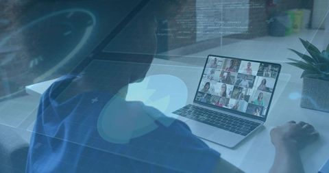 Joining remote team meeting on laptop with HUD overlay in modern home office workspace