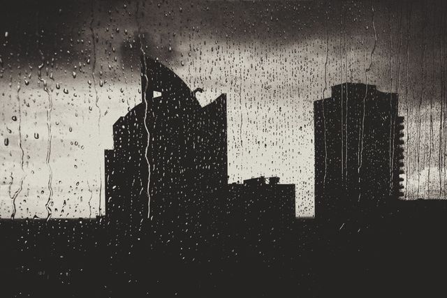 Rain-Drenched Silhouette of City Skyline - Download Free Stock Photos Pikwizard.com