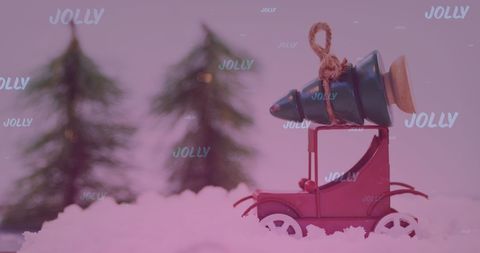 Christmas model car carrying tree in snowy landscape